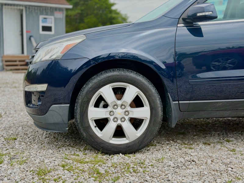 Navy blue Chevrolet Traverse LT AWD, front wheel and fender detail